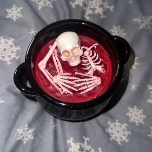 Cauldron Red Candle with melting skeleton